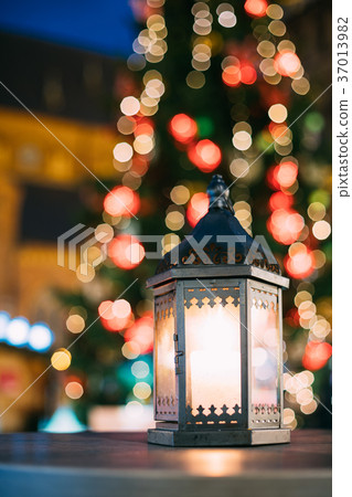 Christmas Lantern With Burning Candle On Bright Christmas Lantern With Burning Candle On Bright 37013982