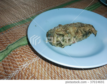 Thai food in a plate on a mat. Thai food in a plate on a mat. 37014691