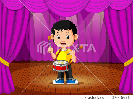 Cute boy playing drum on stage 37016656