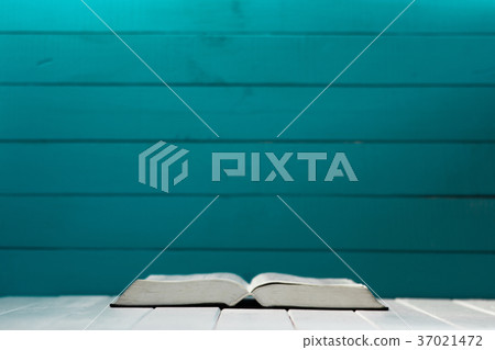 Bible on a white wooden table. Beautiful aquamarin 37021472