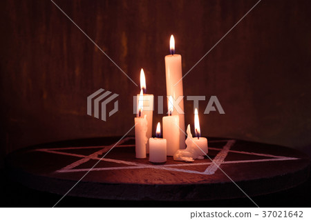 Six burning candles and the Star of David against Six burning candles and the Star of David against 37021642