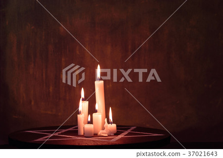 Six burning candles and the Star of David against Six burning candles and the Star of David against 37021643