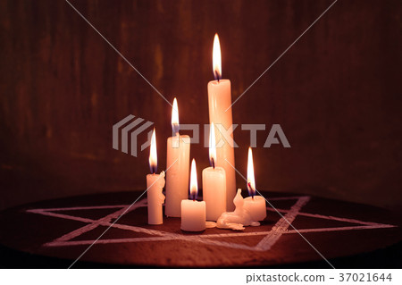 Six burning candles and the Star of David against Six burning candles and the Star of David against 37021644