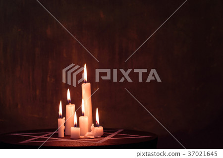 Six burning candles and the Star of David against 37021645