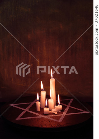 Six burning candles and the Star of David against 37021646