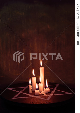 Six burning candles and the Star of David against Six burning candles and the Star of David against 37021647