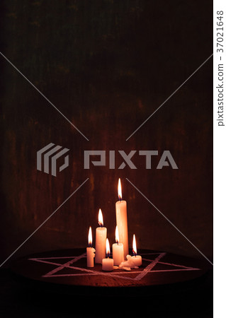 Six burning candles and the Star of David against Six burning candles and the Star of David against 37021648