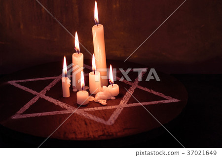Six burning candles and the Star of David against Six burning candles and the Star of David against 37021649