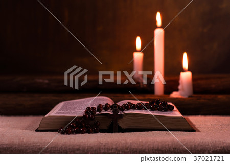 Bible crucifix and beads with a candle Bible crucifix and beads with a candle 37021721