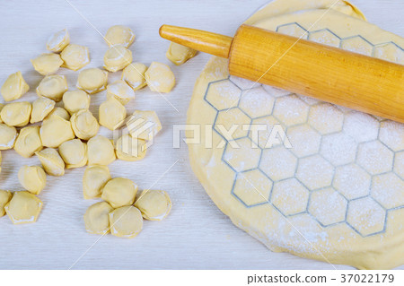 Preparation of pelmeni at home in the kitchen  37022179