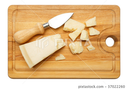 pieces of Parmesan cheese on wooden cutting board pieces of Parmesan cheese on wooden cutting board 37022260