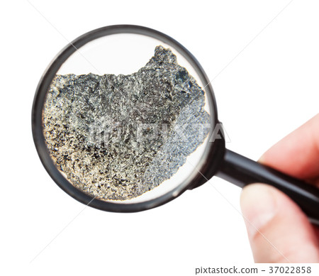 view of rough peridotite mineral through magnifier view of rough peridotite mineral through magnifier 37022858