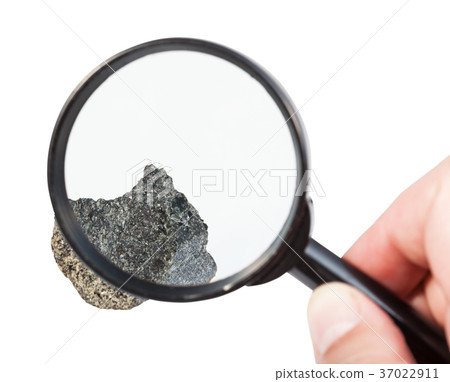 view of raw peridotite stone through magnifier view of raw peridotite stone through magnifier 37022911