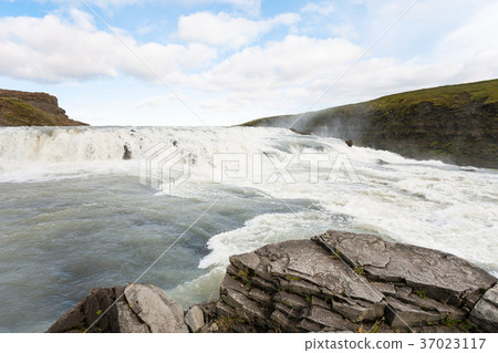 water flow on rapids of Gullfoss waterfall 37023117