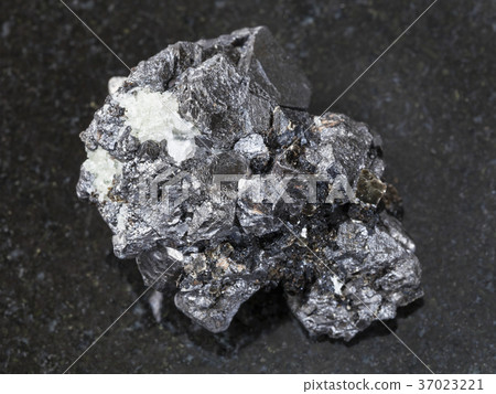 raw crystalline Magnetite stone on dark 37023221