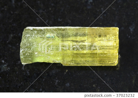 rough crystal of Heliodor (yellow beryl) on dark 37023232