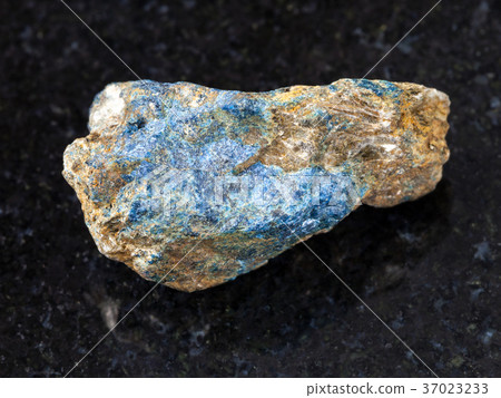raw Lazulite stone on dark background 37023233