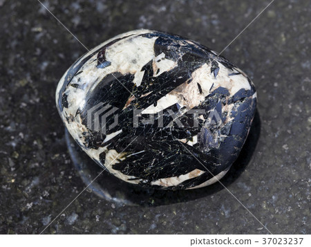 aegirine crystals in polished microcline on dark aegirine crystals in polished microcline on dark 37023237