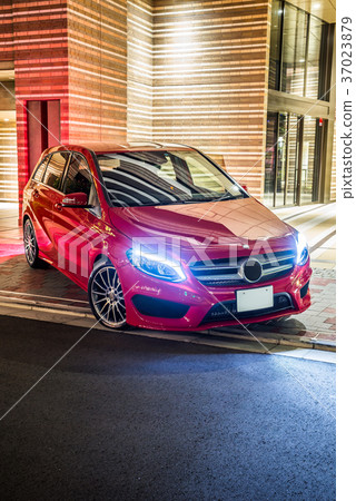 Night view with red car and apartment 37023879