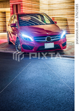 Night view with red car and apartment 37023885