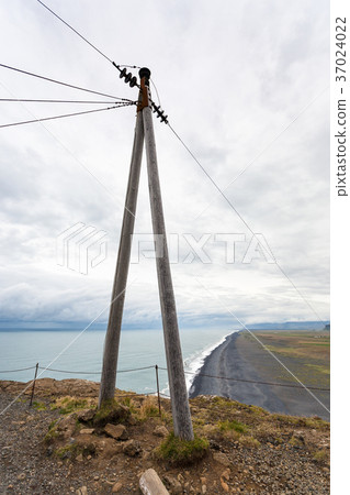 power line post on Dyrholaey peninsula in Iceland power line post on Dyrholaey peninsula in Iceland 37024022