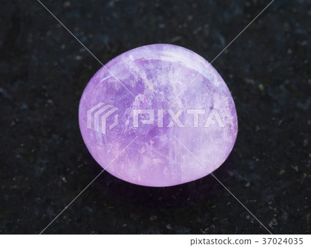 polished Amethyst crystal on dark background polished Amethyst crystal on dark background 37024035