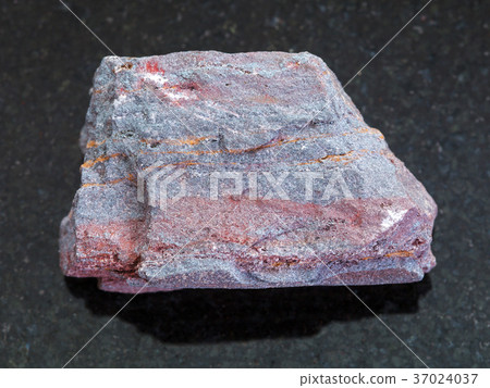 rough jaspilite (ferruginous quartzite) on dark rough jaspilite (ferruginous quartzite) on dark 37024037