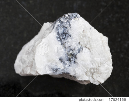 rough Wolframite ore on dark background 37024166