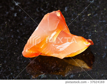 crystal of cornelian (red chalcedony) on dark crystal of cornelian (red chalcedony) on dark 37024169