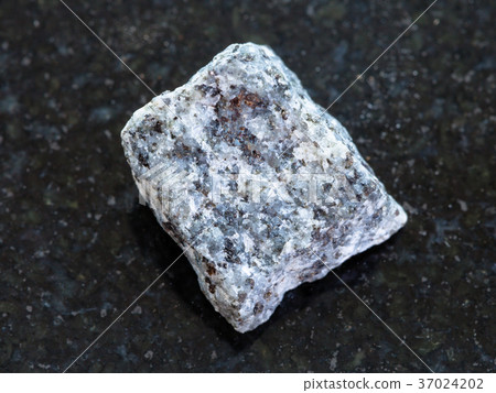 raw Gabbro stone on dark background 37024202