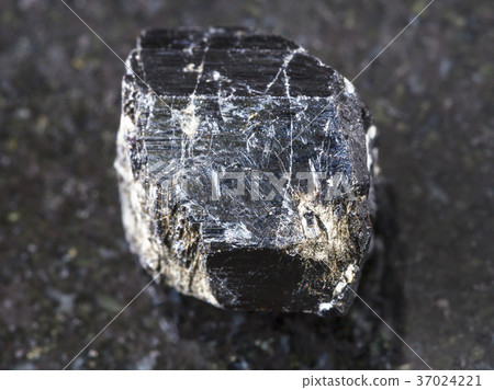 raw crystal of Schorl (black tourmaline) on dark 37024221