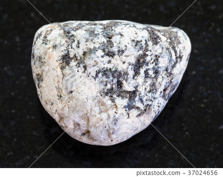 piece of Diorite stone on dark background piece of Diorite stone on dark background 37024656