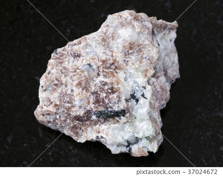 raw Miserite stone on dark background 37024672