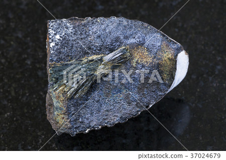 raw Vivianite stone on dark background raw Vivianite stone on dark background 37024679