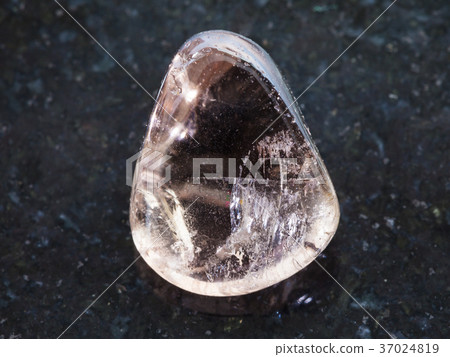 polished smoky quartz gemstone on dark 37024819