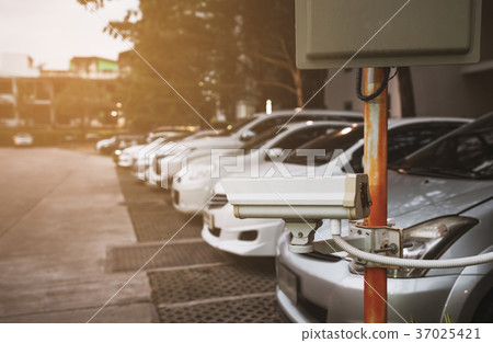 Security camera at car parked area in residence 37025421