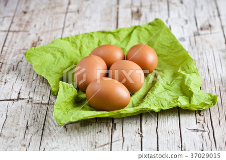 fresh brown eggs on green napkin fresh brown eggs on green napkin 37029015