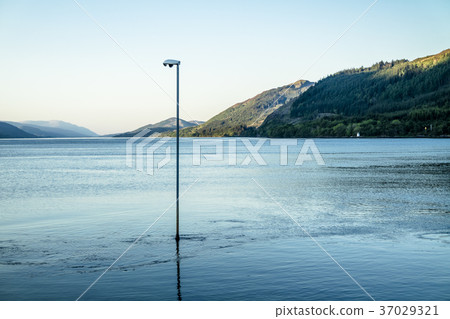 Lake is flooding a lamp post Lake is flooding a lamp post 37029321