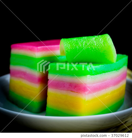 Colorful Asian sweet layer cake in white dish   37029612