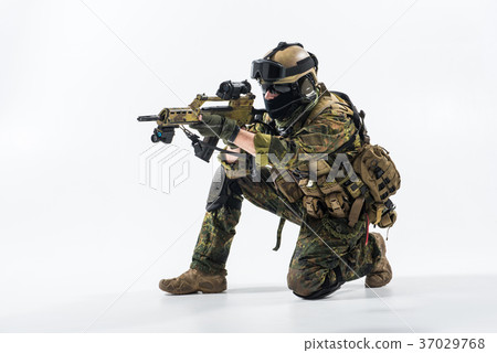 Male peacemaker firing with assault carbine Male peacemaker firing with assault carbine 37029768