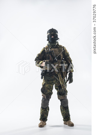 Serene soldier working with assault carbine Serene soldier working with assault carbine 37029776