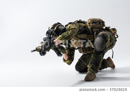 Male soldier shooting with assault carbine 37029829