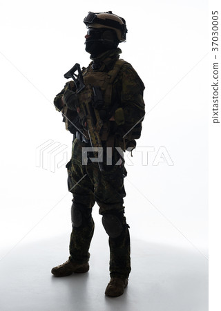 Serious defender keeping modern weapon in arms 37030005