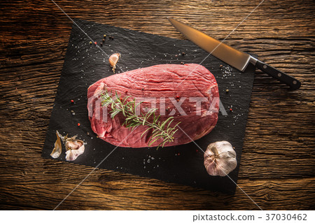 Flank steak with rosemary garlic salt and pepper. 37030462