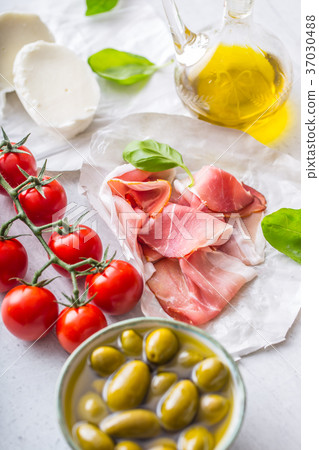 Prosciutto Olives olive oil mozzarella cheese Prosciutto Olives olive oil mozzarella cheese 37030488
