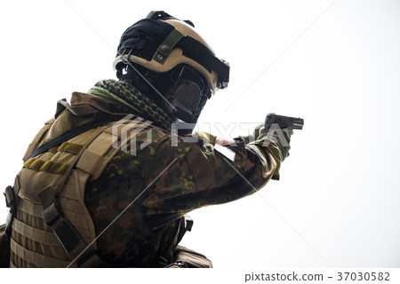 Soldier firing with modern pistol Soldier firing with modern pistol 37030582