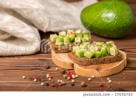sandwiches with diced avocado, cutted rye bread sandwiches with diced avocado, cutted rye bread 37030783