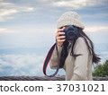 Photographer taking photo of landscape 37031021
