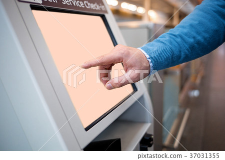 Man is touching interactive display in modern 37031355