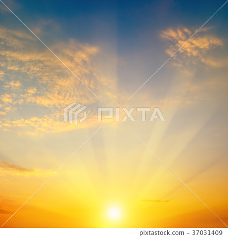 Cloudy sky and bright sun rise over the horizon. Cloudy sky and bright sun rise over the horizon. 37031409